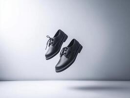 pair of black school shoes is floating in air, showcasing their sleek design and polished finish, evoking sense of style and elegance photo