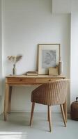 light wooden desk with two drawers is complemented by stylish chair, creating serene workspace. decor includes framed artwork and decorative items photo
