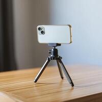 smartphone mounted on tripod, placed on wooden table with soft background, showcasing modern technology and convenience photo