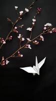 White origami paper bird and flower makes you feel fragility and peace. Minimalist aesthetic presents calming moment in nature photo