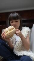 A Happy Child Enjoying Delicious Freshly Baked Bread in a Cozy, Loving Indoor Setting video