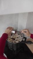 Cooking Routine The Process of Adding Ingredients to a Pot for Delicious Meals and More video