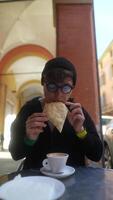 Savoring Coffee and Bread Outside in an Inviting and Charming Setting Filled with Life video