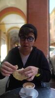 Relishing a delicious coffee and snack while relaxing in a charming, delightful archway video