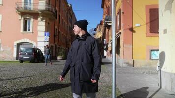 A Young Man in an Urban Setting is Gesturing and Expressing Himself on a Beautiful Sunny Day video