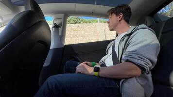 A Young Passenger Enjoys the Comfortable Interior of a Modern Autonomous Vehicle During a City Ride video
