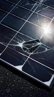 damaged solar panel with cracked glass and noticeable hole reflects impact of wear and tear on renewable energy technology photo