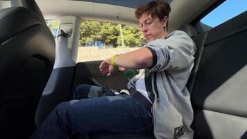A passenger is enjoying a relaxing experience in a futuristic autonomous vehicle video