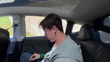 A Passenger Happily Enjoying a Scenic Ride in a Very Modern Car While Taking in Views video