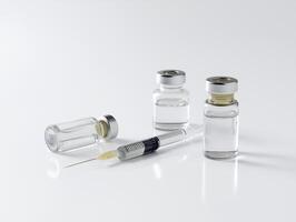 syringe and two vials on table with clean white background, symbolizing medical preparation and health photo