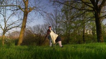 A Young Couple Enjoying Nature Together while Relaxing in a Beautiful Park Setting video