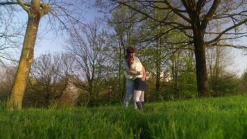 A couple is lovingly embracing in a serene outdoor setting, expressing joy and connection video