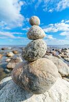 Pyramid of stones. Unstable balance of stone objects. Amazing balance of stones. photo