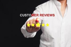 Businessman pointing to Five stars rating of very impressed for service on a virtual screen photo
