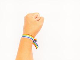 Top view of a rainbow wristband in the wrist on a white background. photo