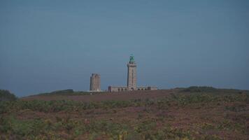 The beautiful coastline next to the Phare Du Cap Frehel is a maritime lighthouse in Cotes de Armor. At the tip of Cap Frehel. Lighthouse Cap Frehel, standing 60m on a rock above the sea video