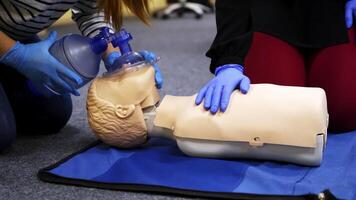 Training compression on a dummy. CPR exercise on a mannequin in the medical center. Teaching skills during heart attack. video