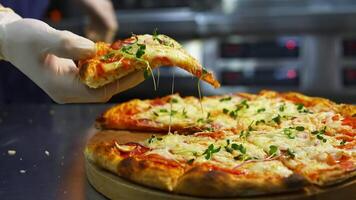 Hand taking pizza slice. Hot tasty pizza ready to eat. Pizza on a wooden board. Delicious pizza with fresh green sprouts. Close-up. video