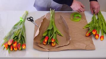 Crafting a tulip bouquet with ribbon on kraft paper, stepbystep arrangement video