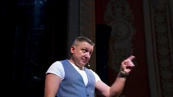 Speaker perform a monologue on stage. Professional actor on stage speaking and gesticulating in theater. video