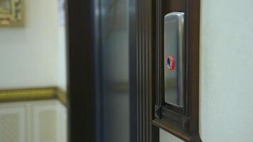 Man's hand presses a lift button. Man pressing elevator button in office center or hotel. Progress future startup concept. Close-up. video