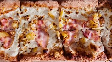 Cheese bubbles and golden crust captured in crispy texture. Texture pops in warm tones, texture appeals to foodie emotions, texture-rich view ideal for detail focused visuals. Juicy hot pizza and ham video