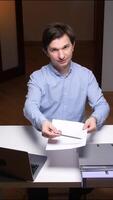 vertical Office worker showing and pointing at contract for signing video