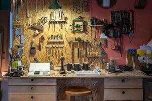 Tidy woodworking workshop with tools displayed in knolling style for easy access. Neat arrangement photo