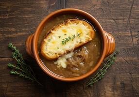 French Onion Soup with cheesy bread and thyme photo