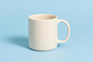Minimal ceramic mug placed on a pastel blue background. Perfect for mockups, branding visuals, product design, packaging concepts, e-commerce, and advertising content. photo