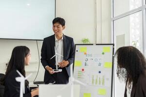 ESG Data Analysis and Team Engagement. Professionals analyzing sustainable growth metrics in an interactive meeting. photo