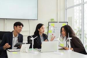 Collaborative ESG Strategy Discussion. Team members evaluate sustainable practices and strategies in a modern office. photo