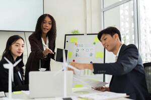 Collaborative ESG Discussion in a Corporate Environment. A team engages in brainstorming innovative solutions for sustainable practices. photo