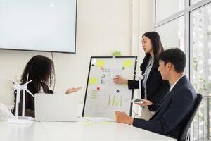 Strategy Presentation and Environmental Advocacy. A professional highlights ESG data insights in a team meeting. photo
