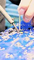 The process of soldering the chip, engineering work. Shot. Close up of male hands using soldering iron during working with chips on the printed circuit board. video