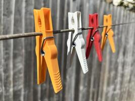 Pegs on a line in the sun ready for the wet washing photo