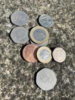 British coins on a hard floor photo