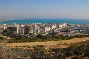Seaside residential buildings near agadir port, view from agadir mountain photo