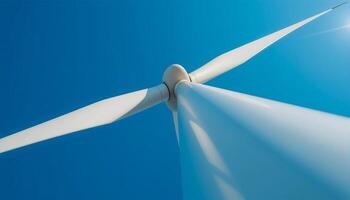 High-Detail Shot of Wind Turbine Blade in Motion with Clean Blue Sky Background photo