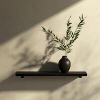 Dark Vase with Green Plant Spring on Floating Shelf Casting Shadow photo