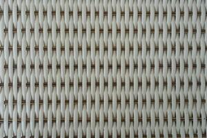 White background with the artificial texture of woven rattan. photo
