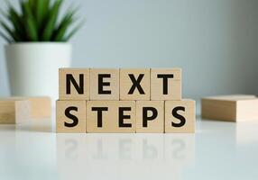Next steps block with wooden blocks on table photo