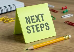 Next steps on a desk with a pencil and paper next steps concept 3d illustration photo