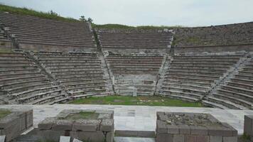 Side aerial view of amphitheater showing ancient architecture and tiers video