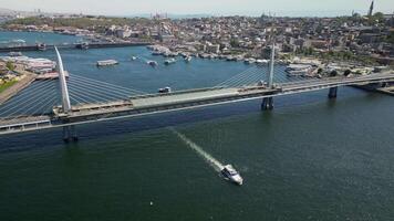 Aerial view of boat leaving the bridge area in Istanbul, Turkey video