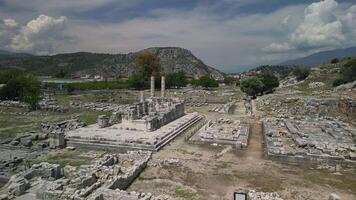 Low drone view of Letoon temple foundation with columns in Turkey video