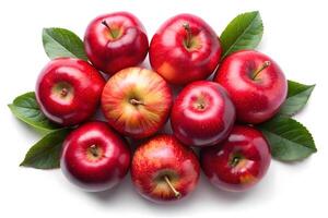 Fresh, vibrant red apples arranged with leaves on white background photo