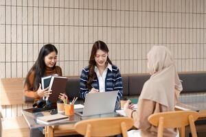 Group Learning and Inspiration. Three friends gather to study and share ideas in a collaborative setting. photo