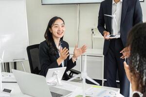 Exciting Brainstorming Session on ESG. A female team member expressing enthusiasm while discussing sustainable initiatives. photo