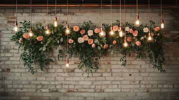 Rustic Industrial Wedding Backdrop with Hanging Light Bulbs on Copper Wires and Romantic Blush Pink Rose Greenery Installation Against Whitewashed Brick Wall photo